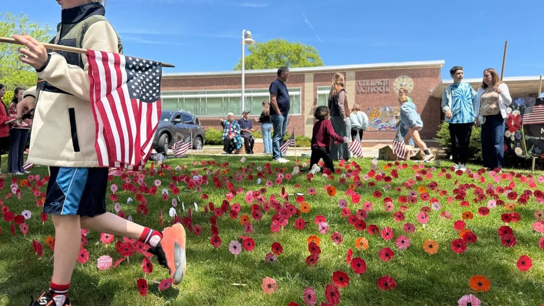 Village School children plant field of paper poppies to honor Marbleheads war dead